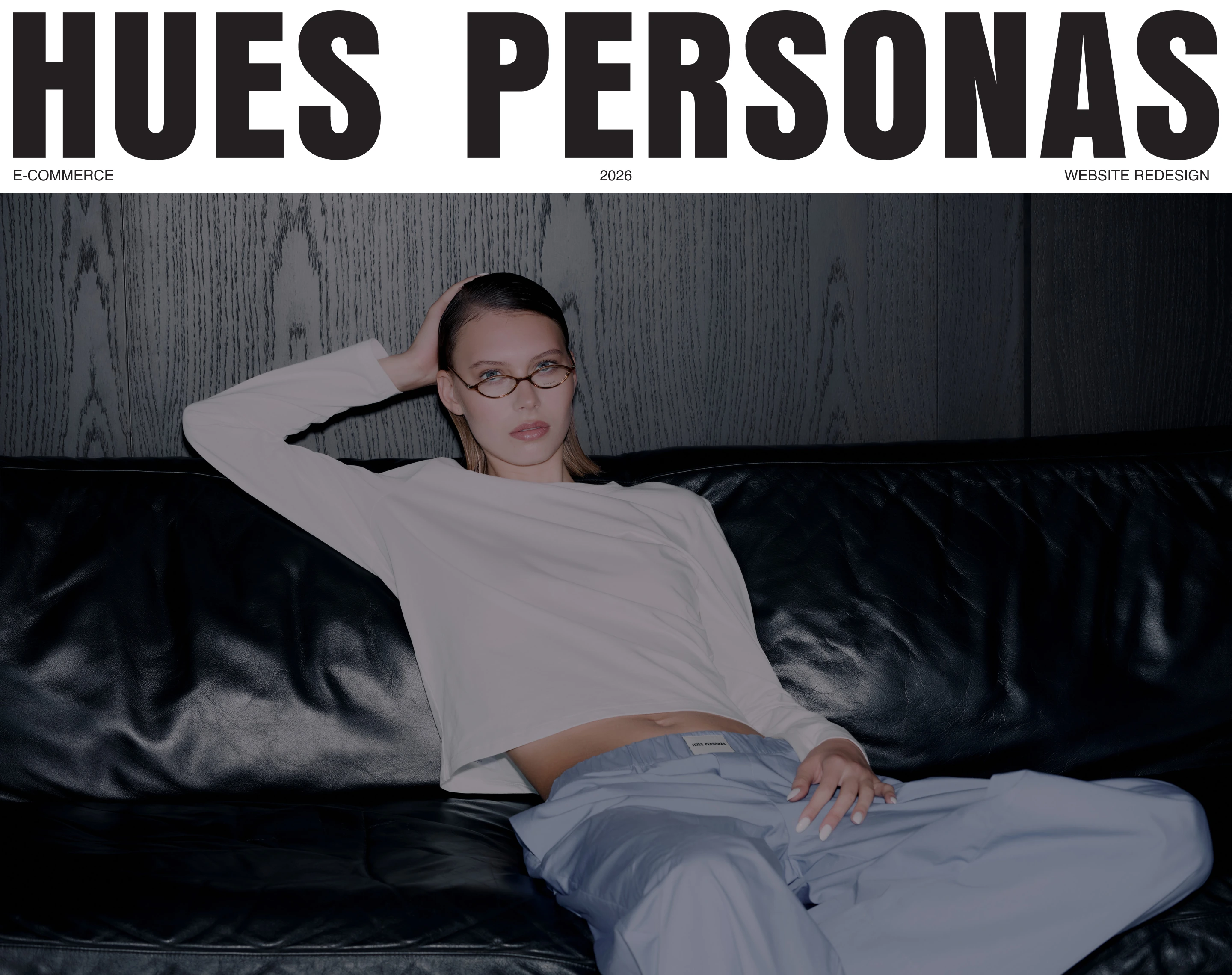 Hues Personas. E-commerce website redesign, 2026. Campaign cover with a model wearing a white top and blue trousers.